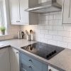 60cm 4 Zone Built-In Ceramic Hob - Black Glass - Scale and room context